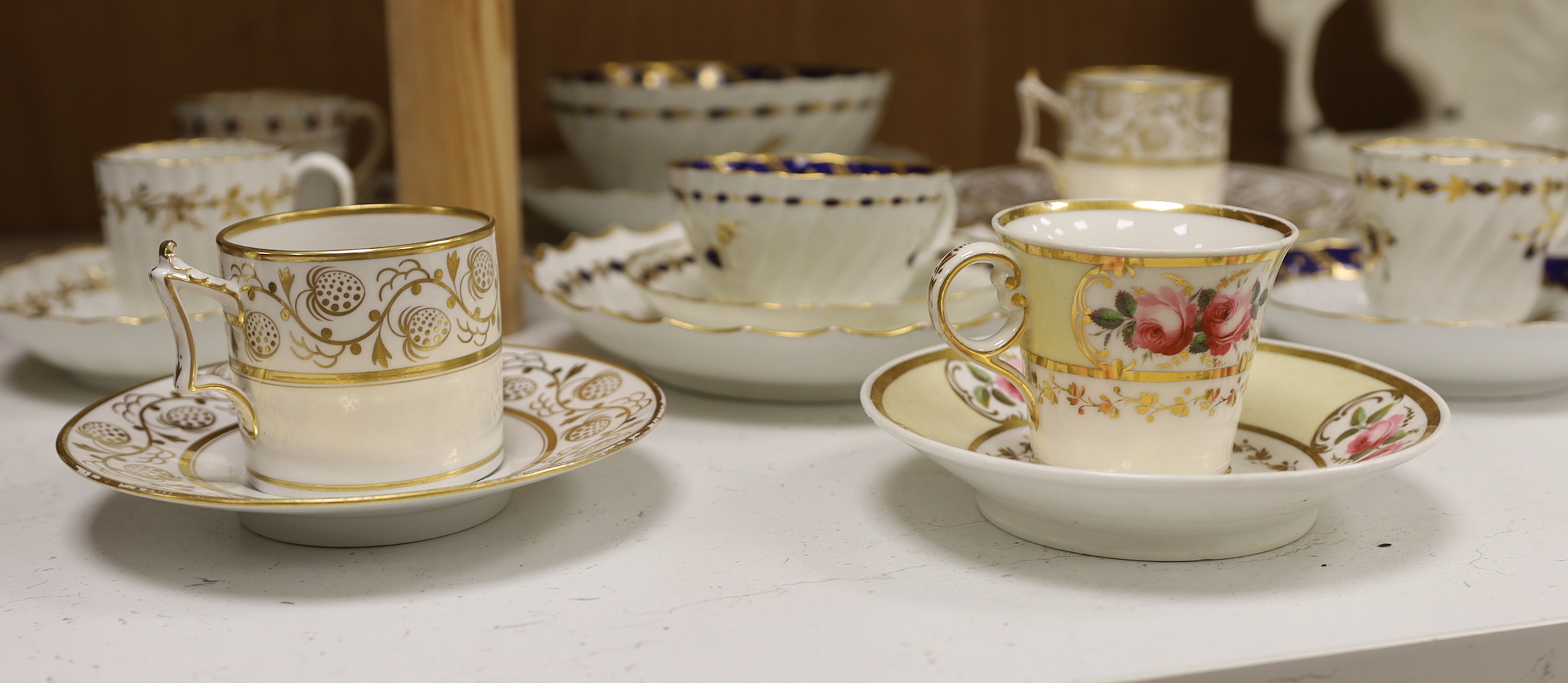 Two Flight Barr and Barr coffee can and matching saucer dish with gilded strawberries, four Flight cups and saucers, two Flight saucer dishes and a bowl together with a Chamberlain coffee can and saucer, bowl 15cm diamet